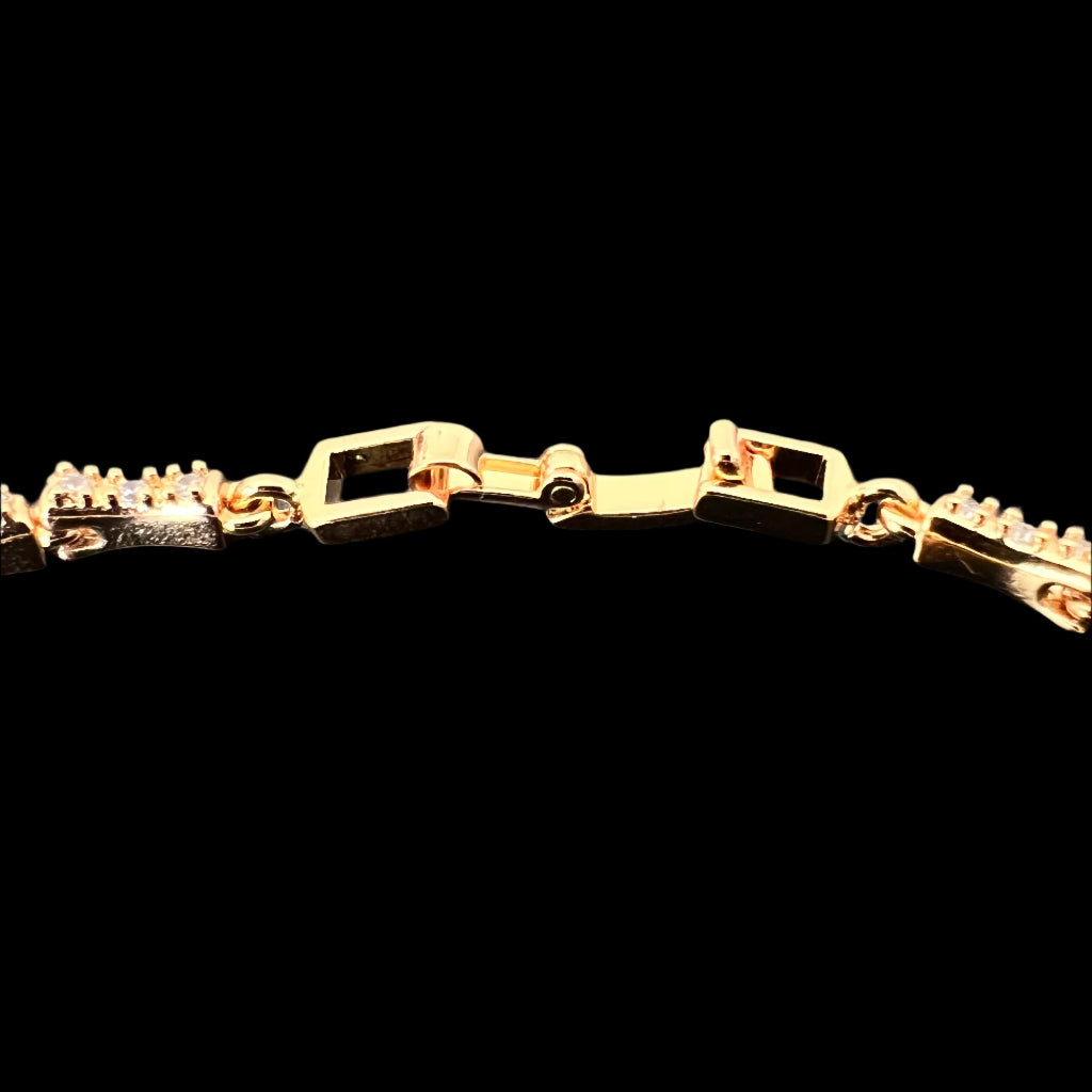 Gold-Tone Snake Bracelet with Green Eyes