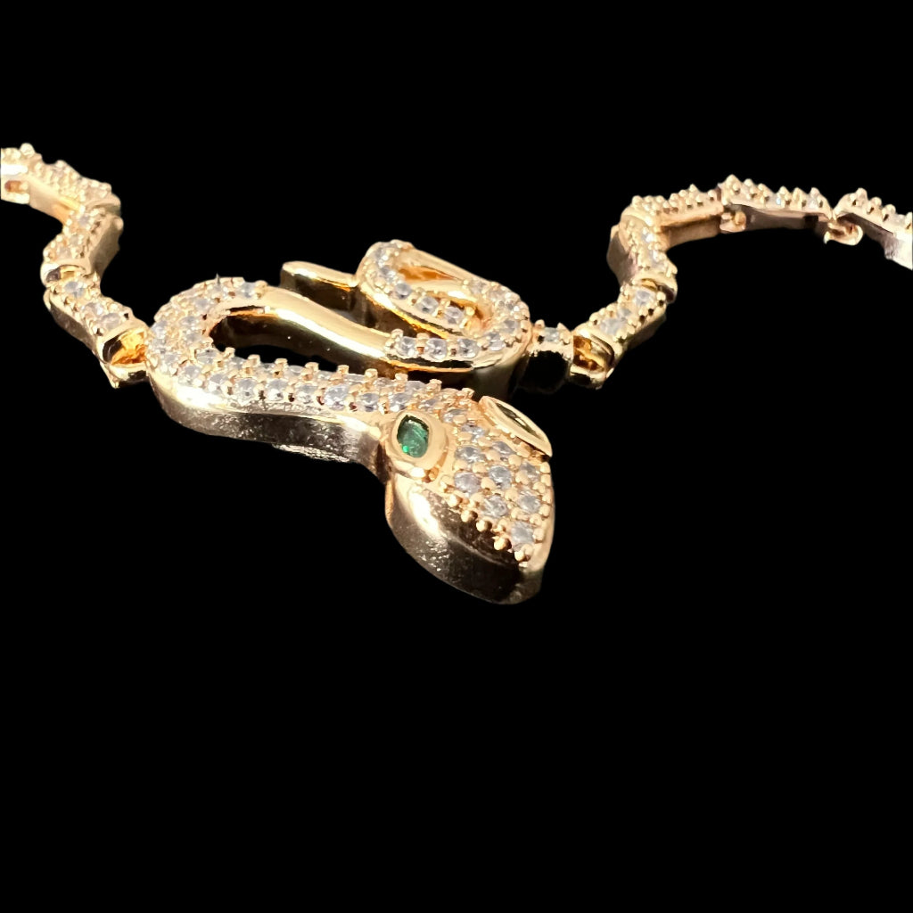 Gold-Tone Snake Bracelet with Green Eyes