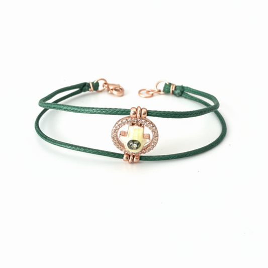 Green bracelet on white background - angled view