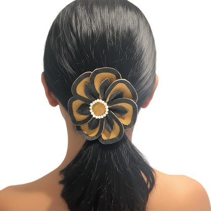 Model wearing black and tan flower hair tie