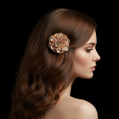 Model wearing peach and tan leather rose hair clip with black background