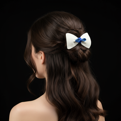 Model wearing white and blue leather bow hair clip with black background